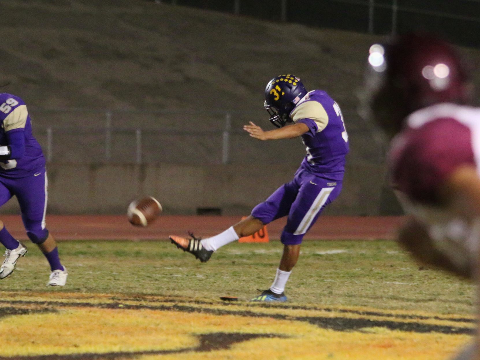 Tigers stay hot with 42-6 rout of Pioneers, clinch playoff spot